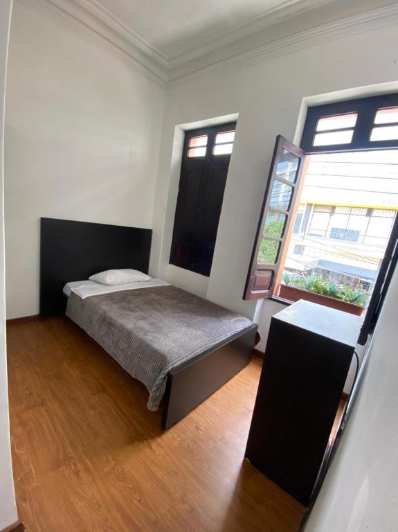 Postel nebo postele na pokoji v ubytování Destino Nómada Calle 11 n 1-38