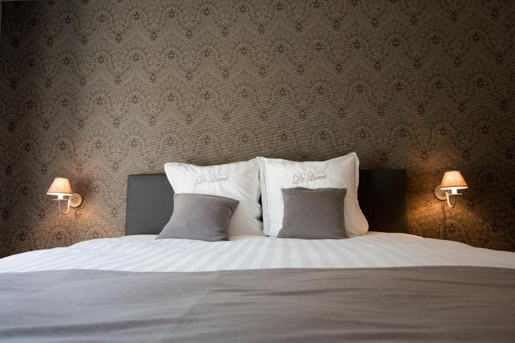 Voodi või voodid majutusasutuse Hotel De Lissewal toas