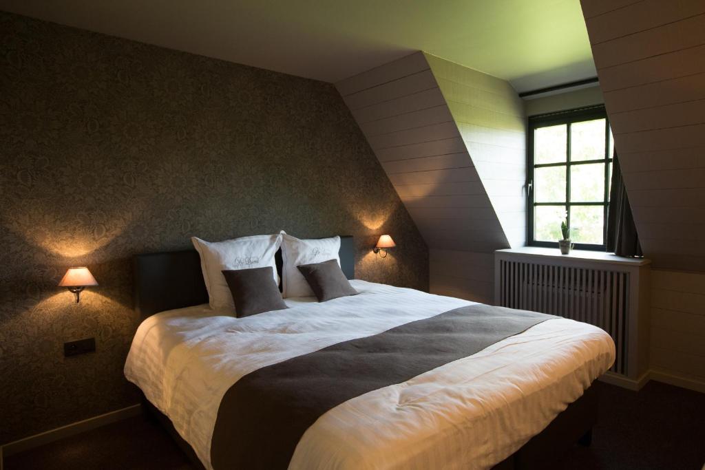 Voodi või voodid majutusasutuse Hotel De Lissewal toas