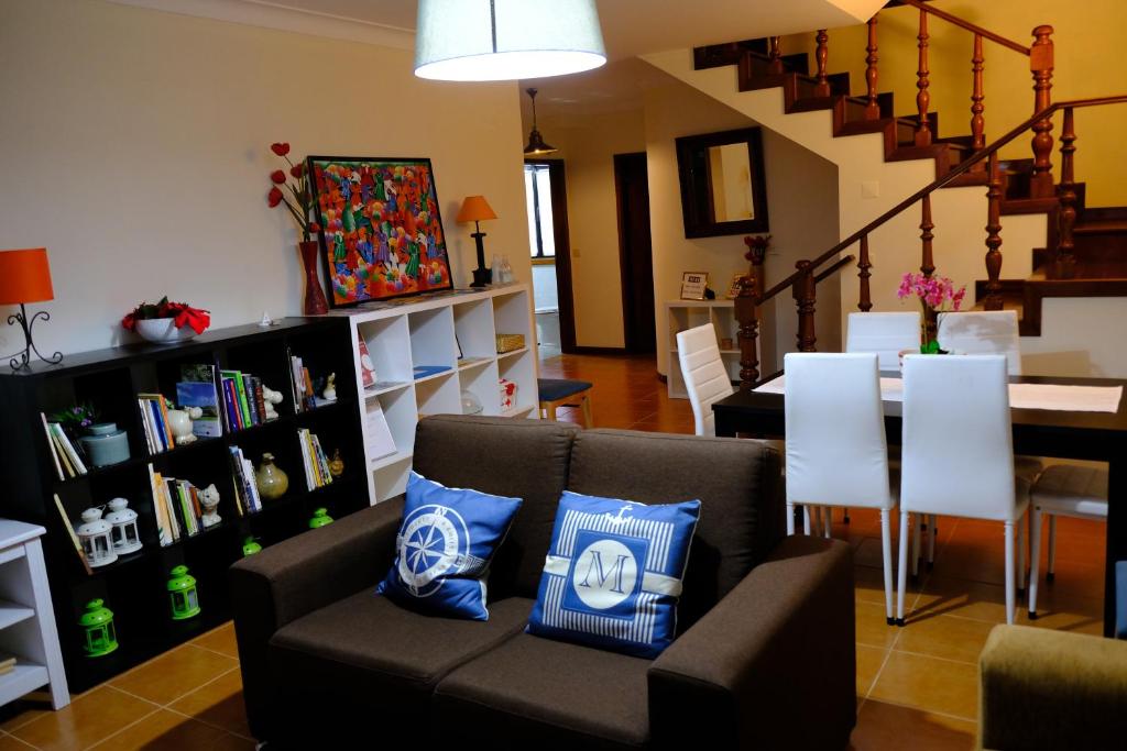 a living room with a couch and a table at Apartamento Alegria in Arouca