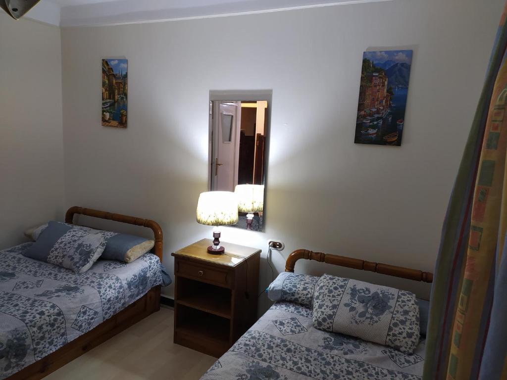 A bed or beds in a room at Maamoura Beach Zahraa Apartment 9/206