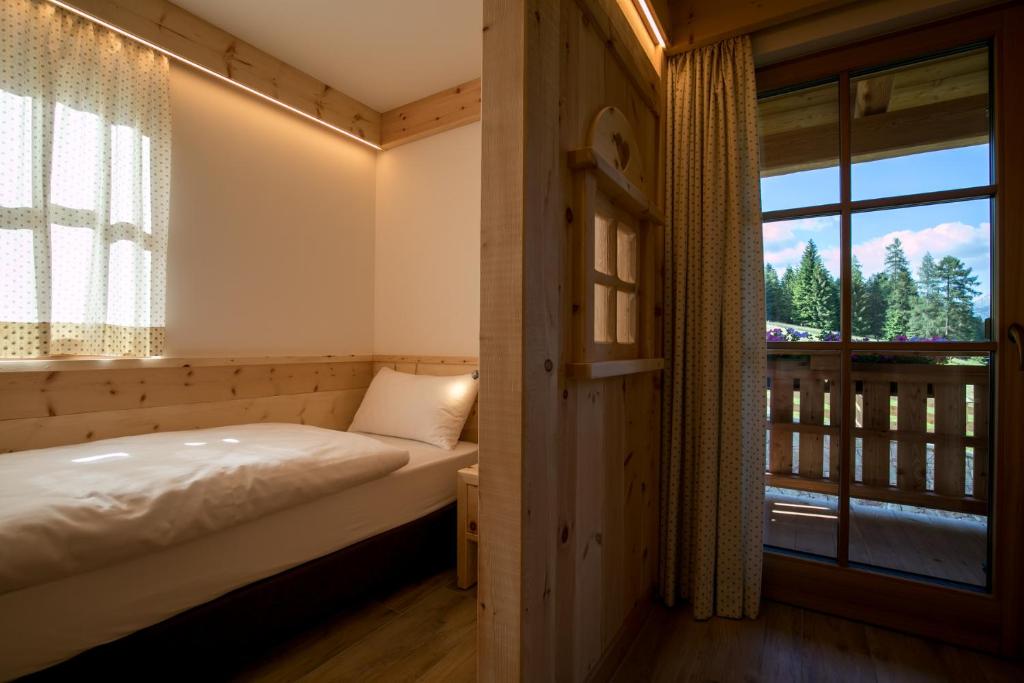 Postel nebo postele na pokoji v ubytování Agriturismo Malga Piè