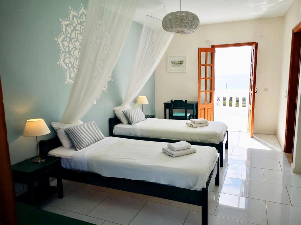 Łóżko lub łóżka w pokoju w obiekcie Kathys Island Retreat