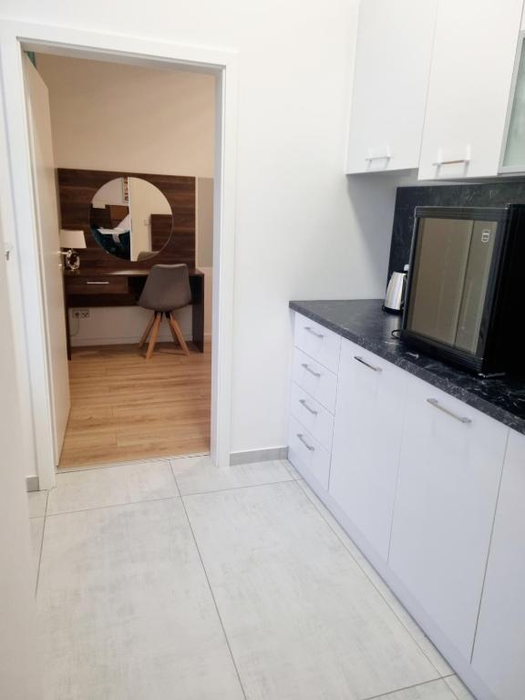Kuchyň nebo kuchyňský kout v ubytování A&F Hotel Chemnitz