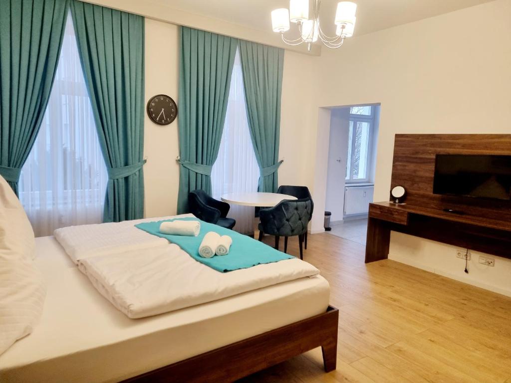 Postel nebo postele na pokoji v ubytování A&F Hotel Chemnitz