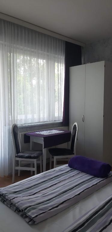 Postel nebo postele na pokoji v ubytování Lila Ház