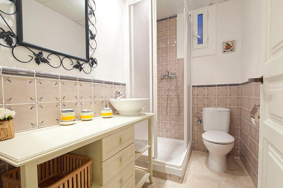 a bathroom with a sink and a toilet and a shower at Stay U-nique Apartments Gaudi II in Barcelona