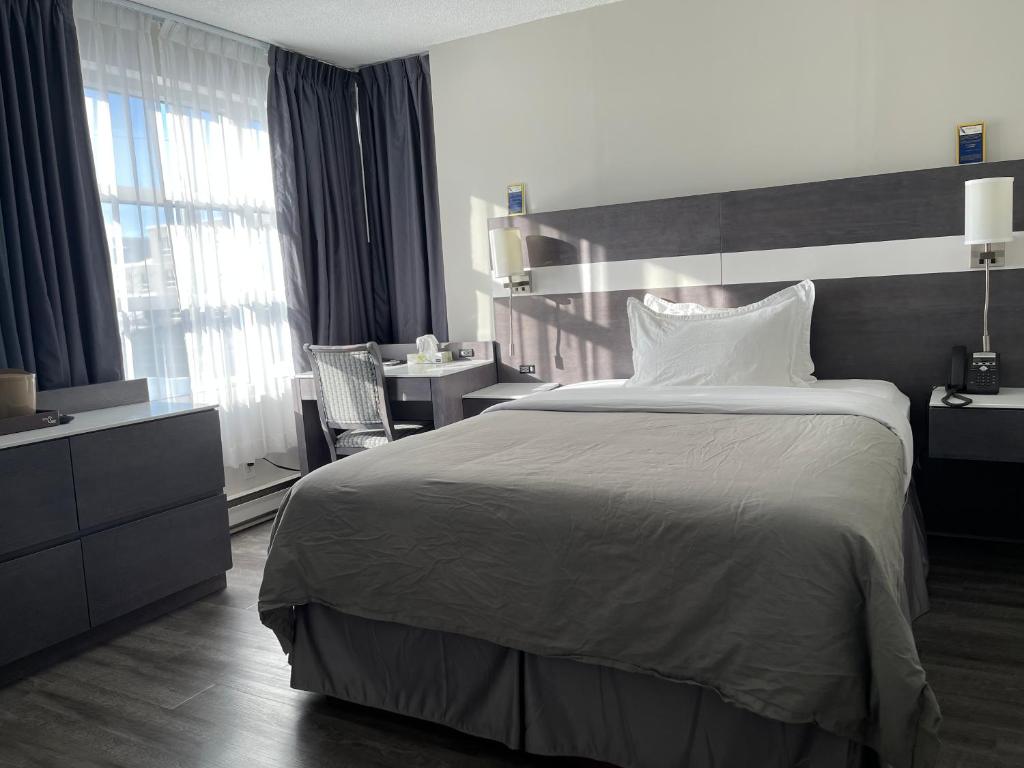 Postel nebo postele na pokoji v ubytování Auberge de la Gare