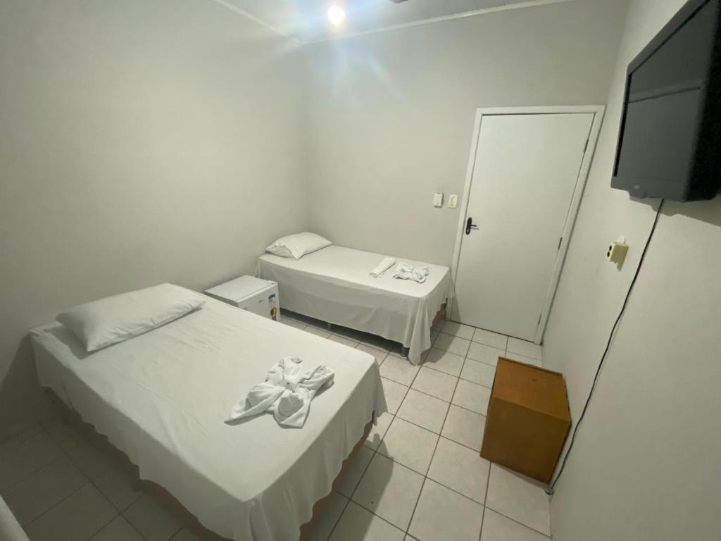 Postel nebo postele na pokoji v ubytování Hotel Bianchi