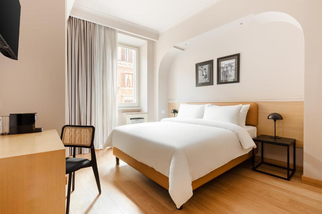 a hotel room with a bed and a desk at Sonder Piazza di Spagna in Rome