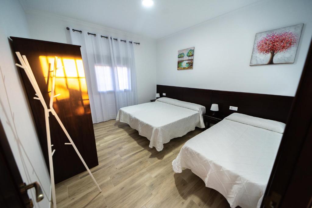 Postel nebo postele na pokoji v ubytování Villa Colorín