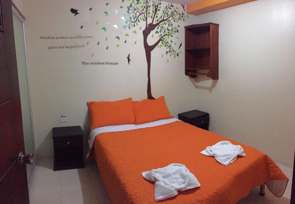 Postel nebo postele na pokoji v ubytování Hostal Bryana Inn Baños