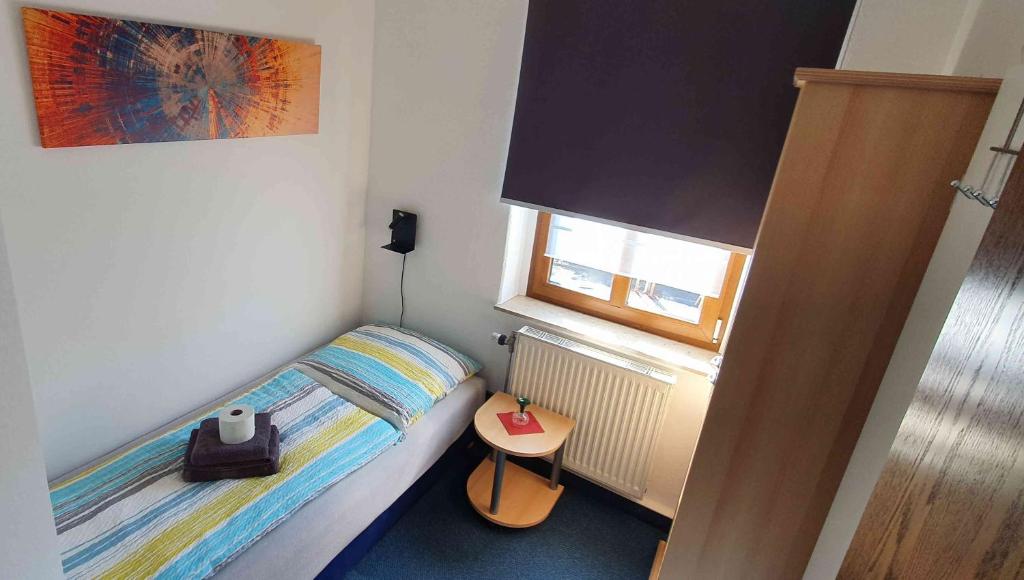Postel nebo postele na pokoji v ubytování Alte Post zu Stetzsch
