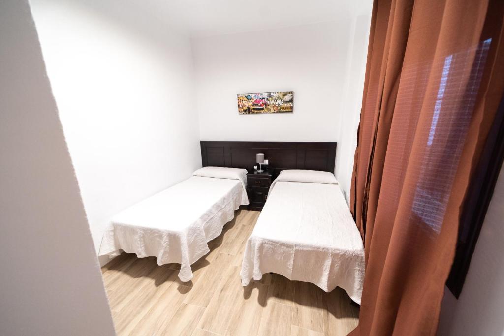 Postel nebo postele na pokoji v ubytování Villa Colorín