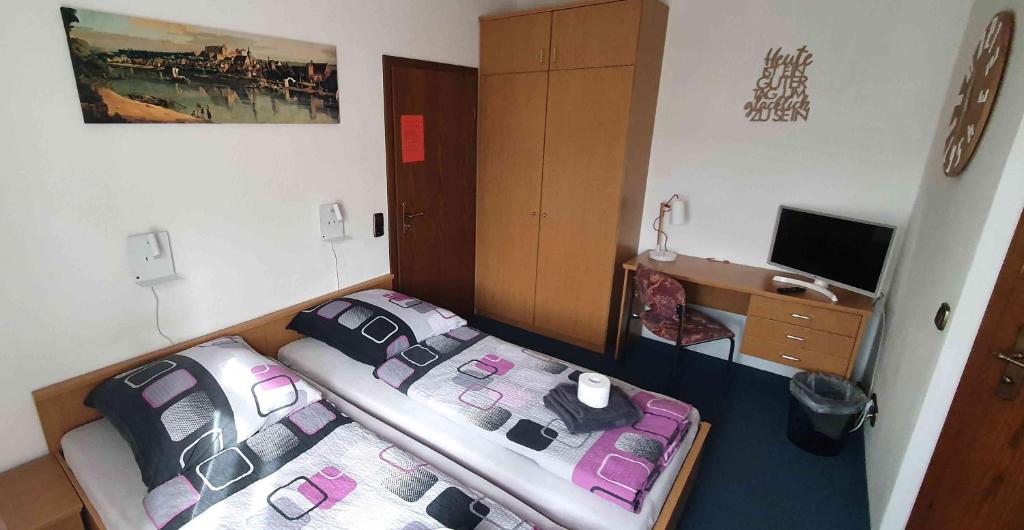 Postel nebo postele na pokoji v ubytování Alte Post zu Stetzsch