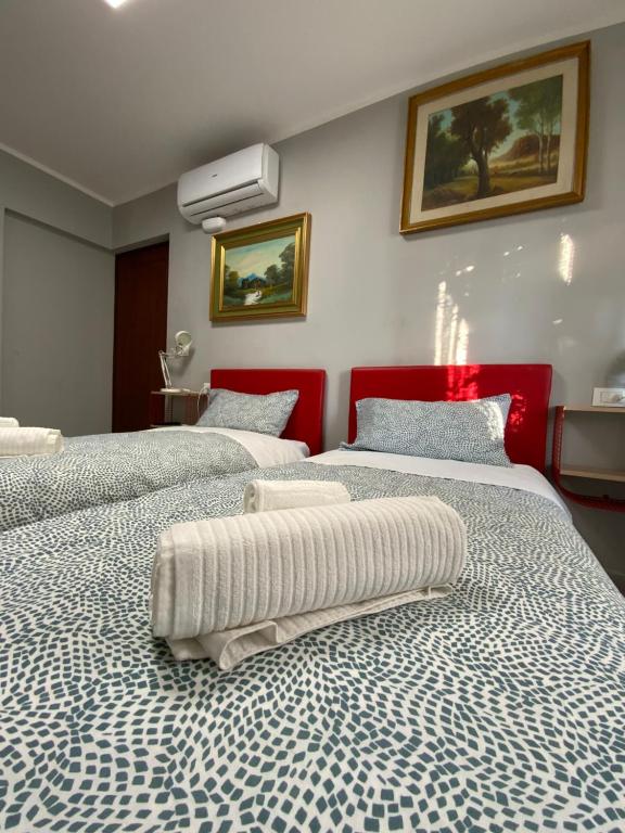 Posteľ alebo postele v izbe v ubytovaní CASA CAMELIE