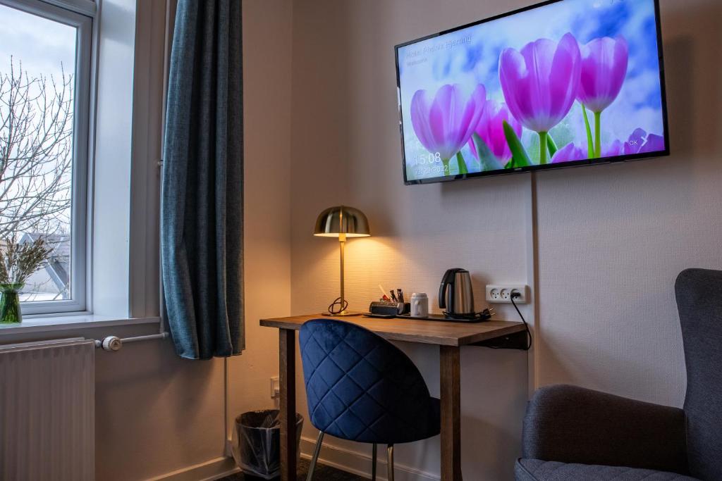 TV a/nebo společenská místnost v ubytování Hotel Phønix Hjørring