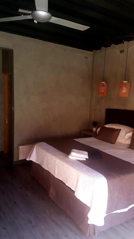 Postel nebo postele na pokoji v ubytování Hoteles Pueblo de Tierra