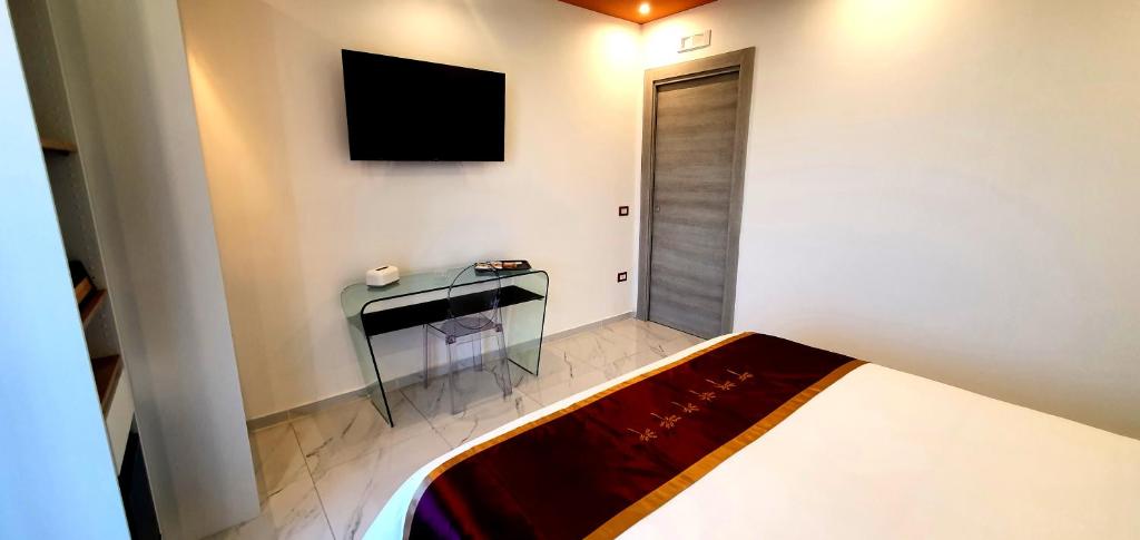 TV a/nebo společenská místnost v ubytování Ercolano Luxury Suite