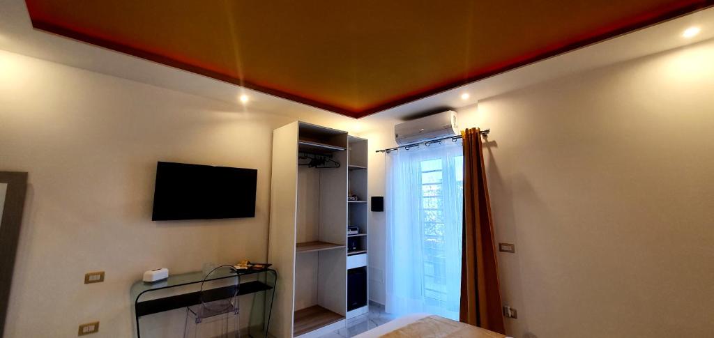 TV a/nebo společenská místnost v ubytování Ercolano Luxury Suite