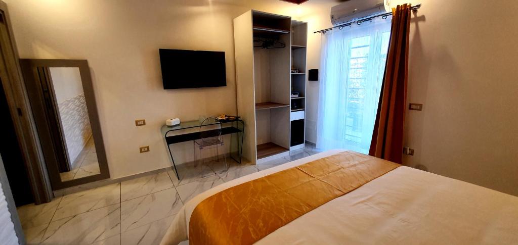 TV a/nebo společenská místnost v ubytování Ercolano Luxury Suite
