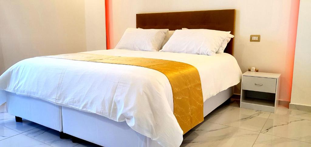 Postel nebo postele na pokoji v ubytování Ercolano Luxury Suite