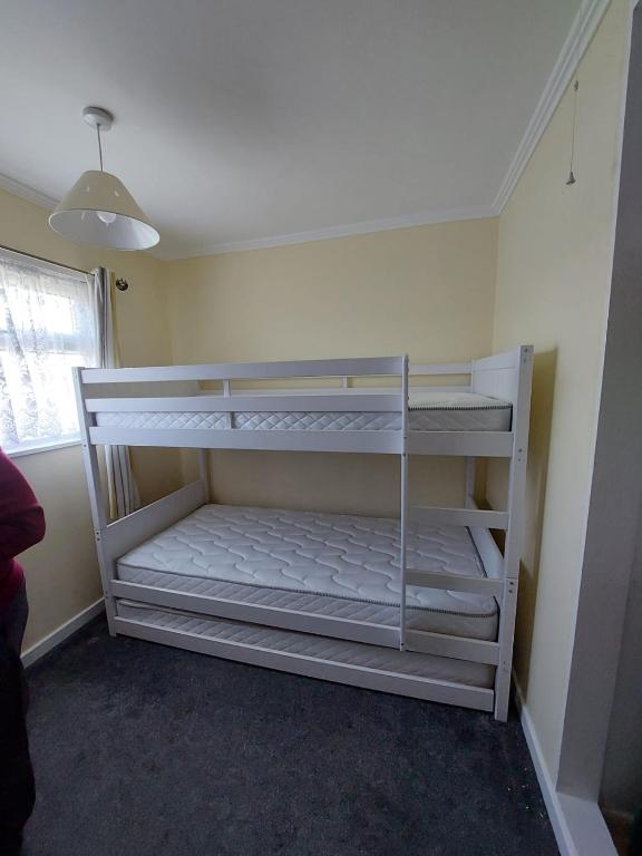 Postel nebo postele na pokoji v ubytování alicias chalets