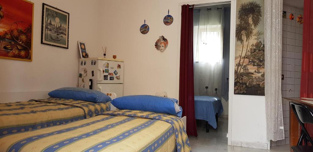 A bed or beds in a room at Casa Albergheria
