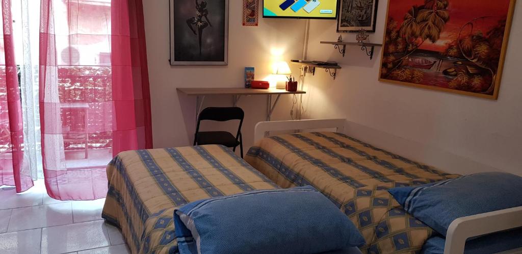 A bed or beds in a room at Casa Albergheria