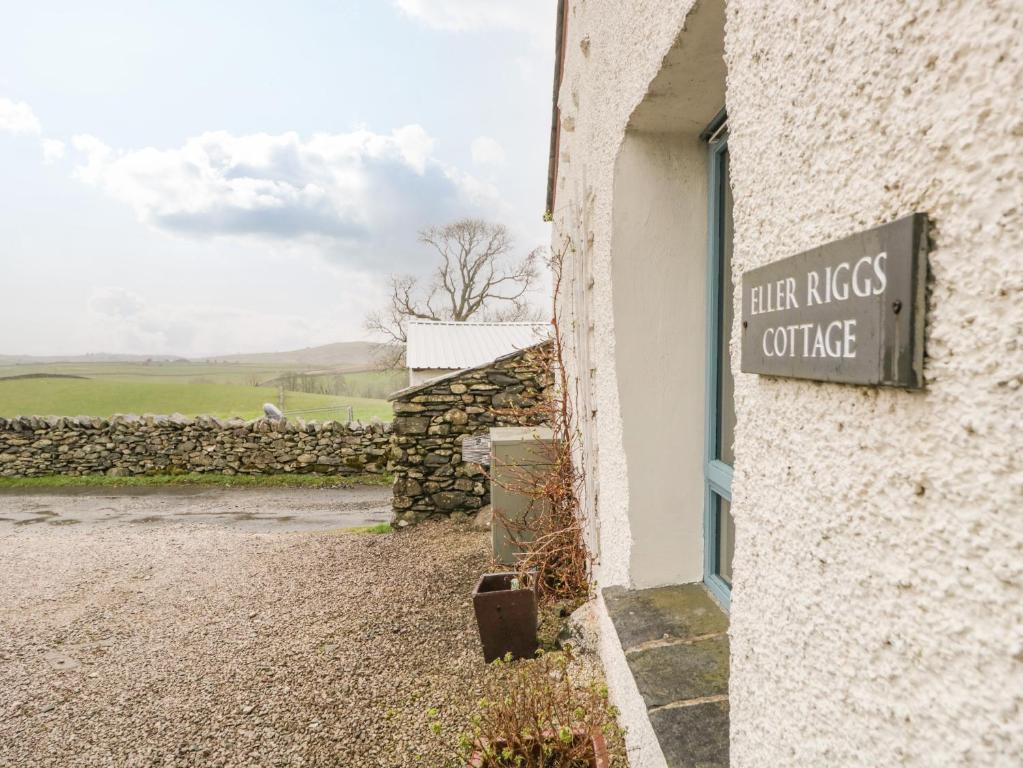 a sign on the side of a building at Eller Riggs Cottage in Ulverston