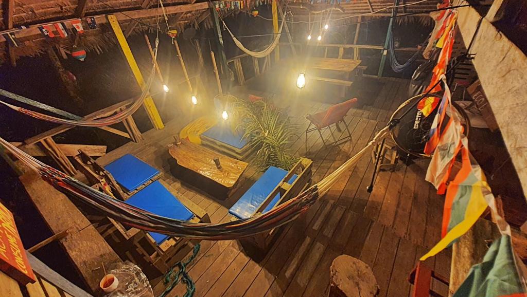an overhead view of a table and a hammock on a boat at Hakuna Matata Ecolodge in El Valle