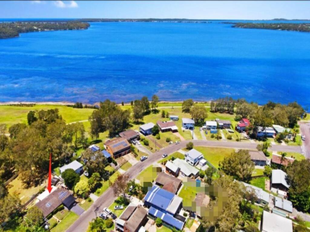an aerial view of a suburb with the water at Lakeside Gem - Lakeview Holiday Home in Lakeside