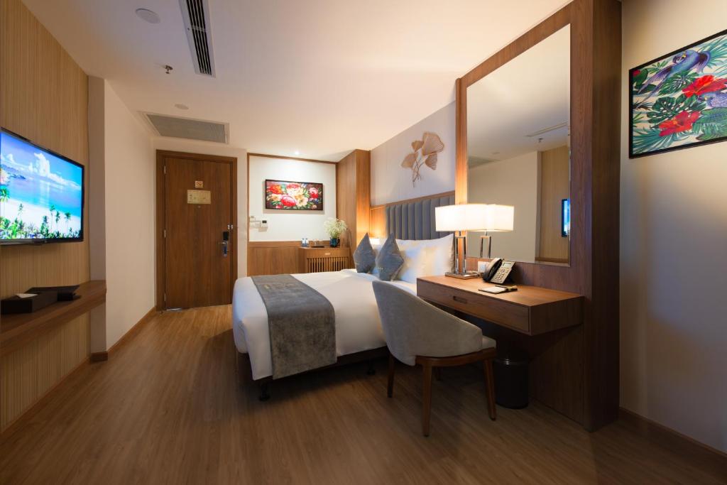 TV a/nebo společenská místnost v ubytování Grand Gosia Hotel