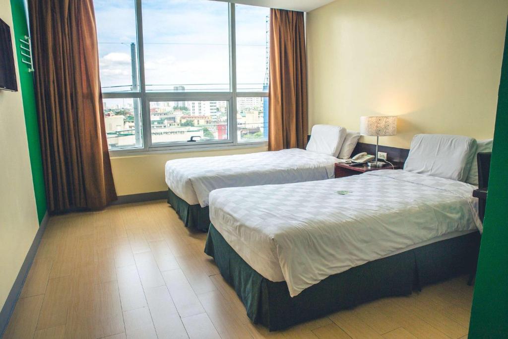 Postel nebo postele na pokoji v ubytování Go Hotels Plus Mandaluyong