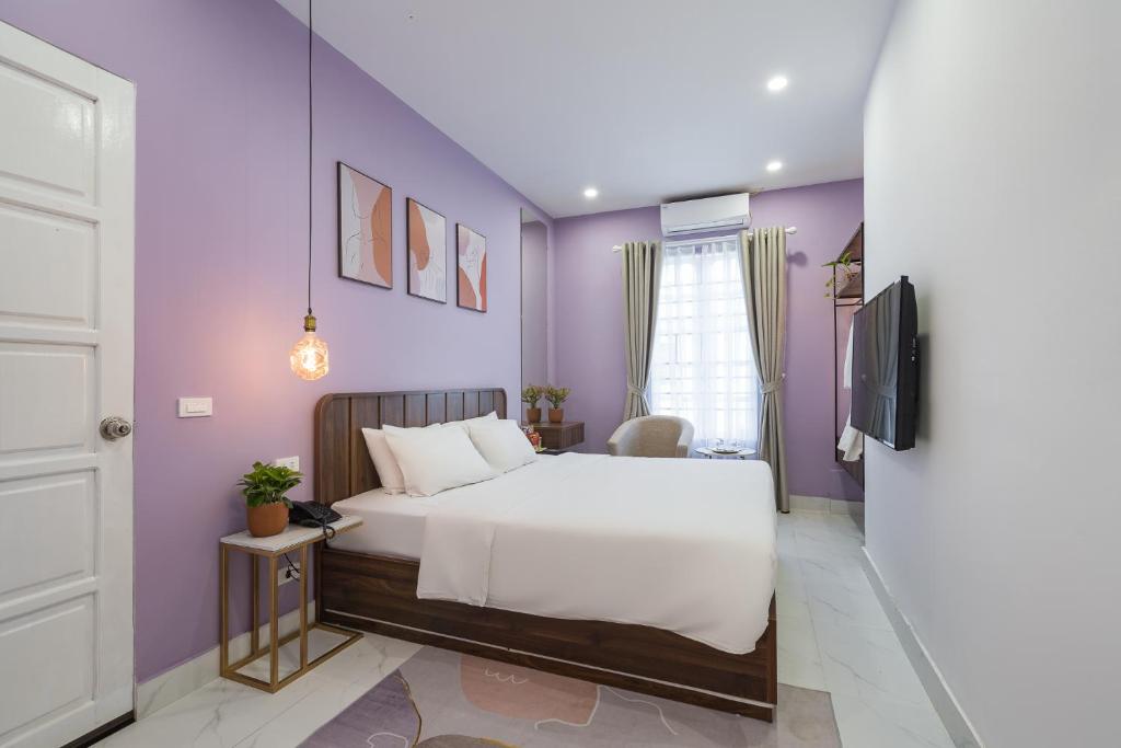 Postel nebo postele na pokoji v ubytování C o r o n a Hanoi House