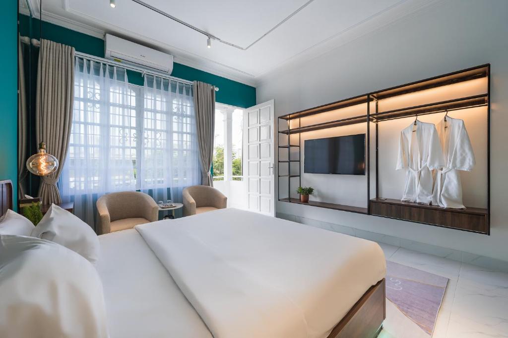 Postel nebo postele na pokoji v ubytování C o r o n a Hanoi House
