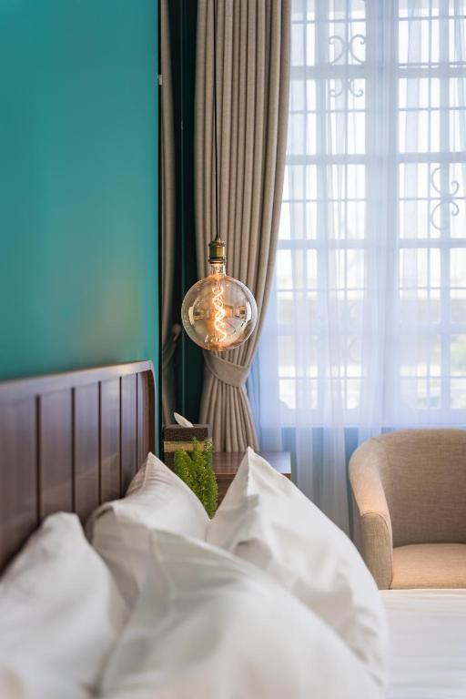Postel nebo postele na pokoji v ubytování C o r o n a Hanoi House