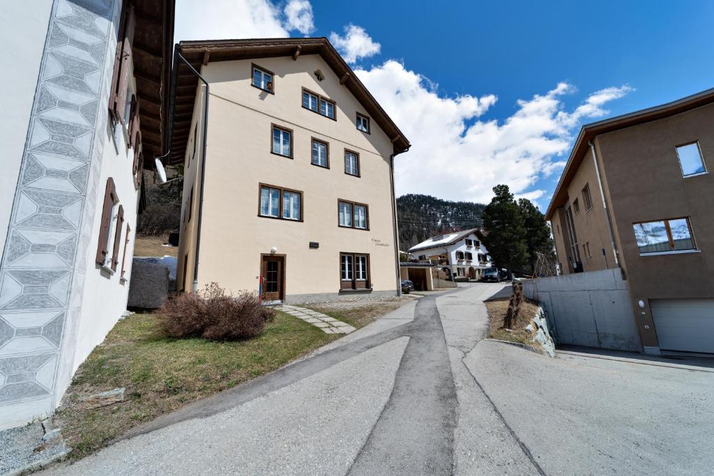an empty street in front of a building at Chesa Giandains - Pontresina in Pontresina