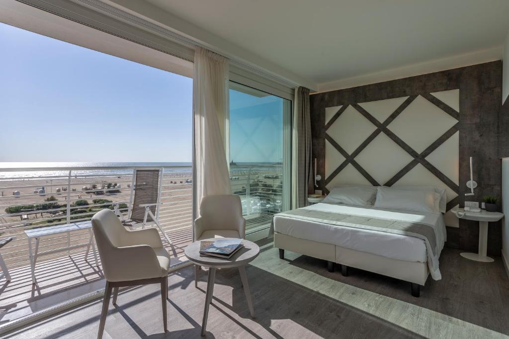 Postel nebo postele na pokoji v ubytování Hotel Doriana