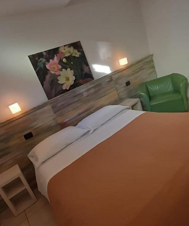 Postel nebo postele na pokoji v ubytování Da Gianni Hotel