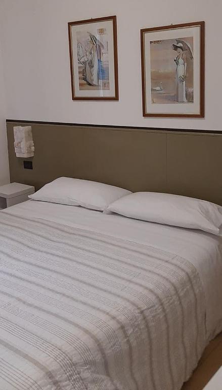 Postel nebo postele na pokoji v ubytování Da Gianni Hotel