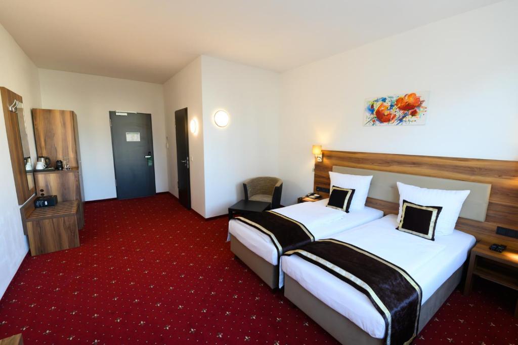 Postel nebo postele na pokoji v ubytování Hotel Luna