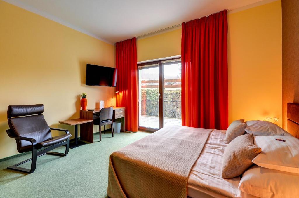 Postel nebo postele na pokoji v ubytování Hotel Hermes