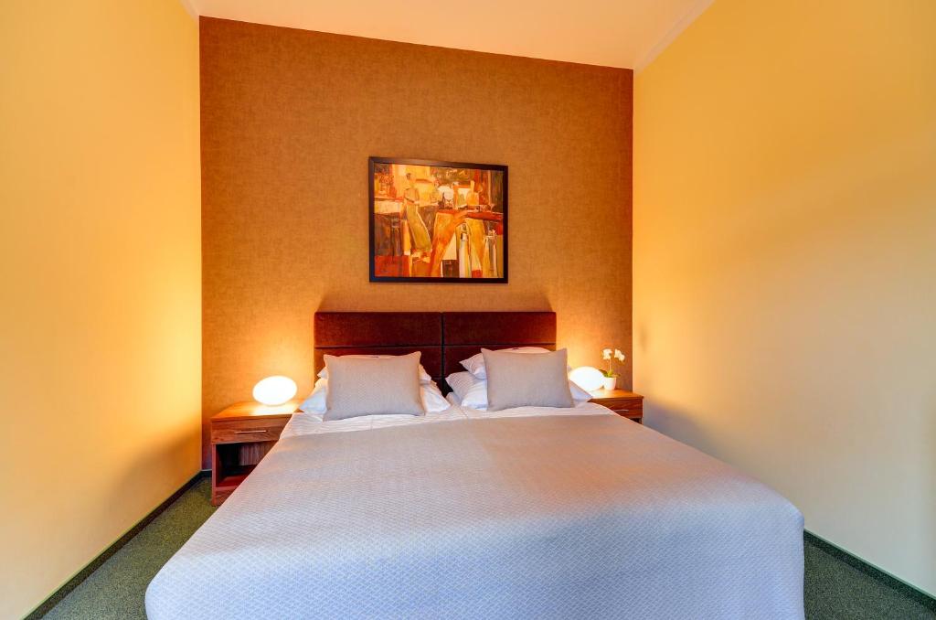 Postel nebo postele na pokoji v ubytování Hotel Hermes