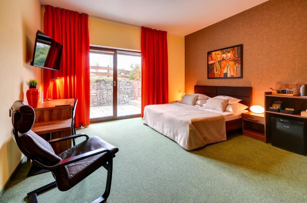 TV a/nebo společenská místnost v ubytování Hotel Hermes