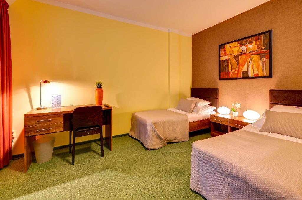 Postel nebo postele na pokoji v ubytování Hotel Hermes