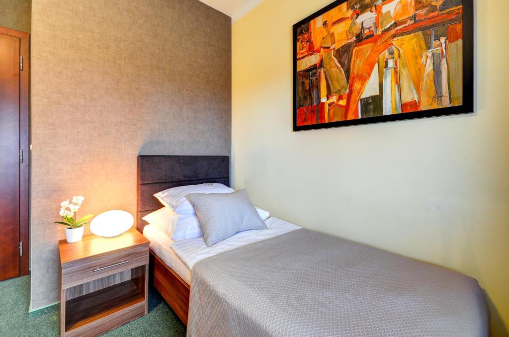 Postel nebo postele na pokoji v ubytování Hotel Hermes