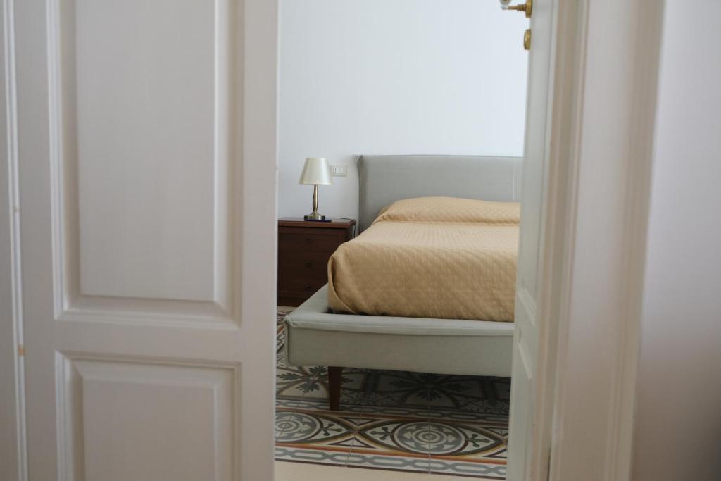 Postel nebo postele na pokoji v ubytování Al Corso Charming Rooms