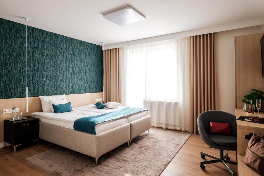 מיטה או מיטות בחדר ב-Adele Apartments