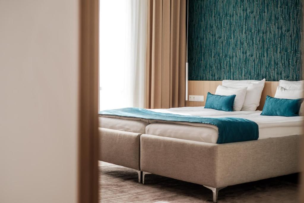 Posteľ alebo postele v izbe v ubytovaní Adele Apartments